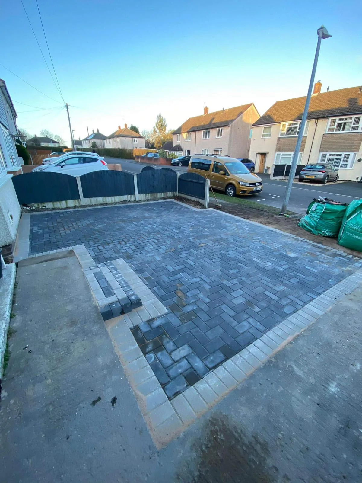 Grey block paving across a front driveway